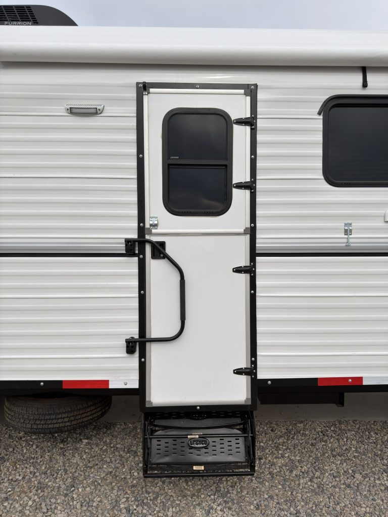 Schrauth Camp entry door, railing, and pull-out steps