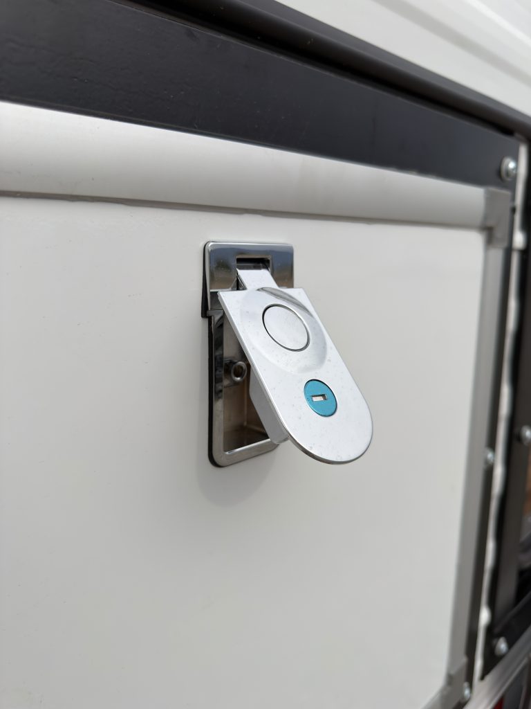 Close-up of the Schrauth Camp exterior compartment latches.