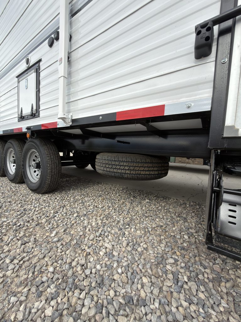 Schrauth Camp spare tire mounted beneath the frame