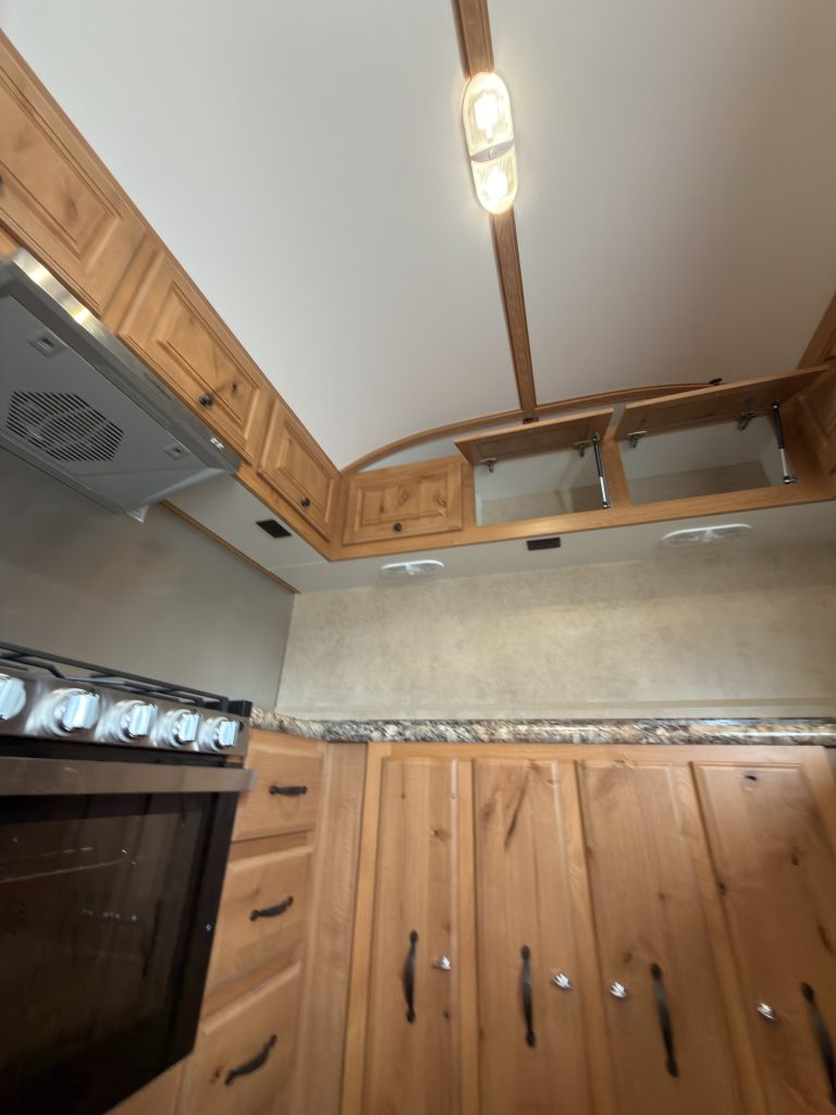 Detail view of Kitchen Cabinetry Beside Range in the Schrauth Camp.