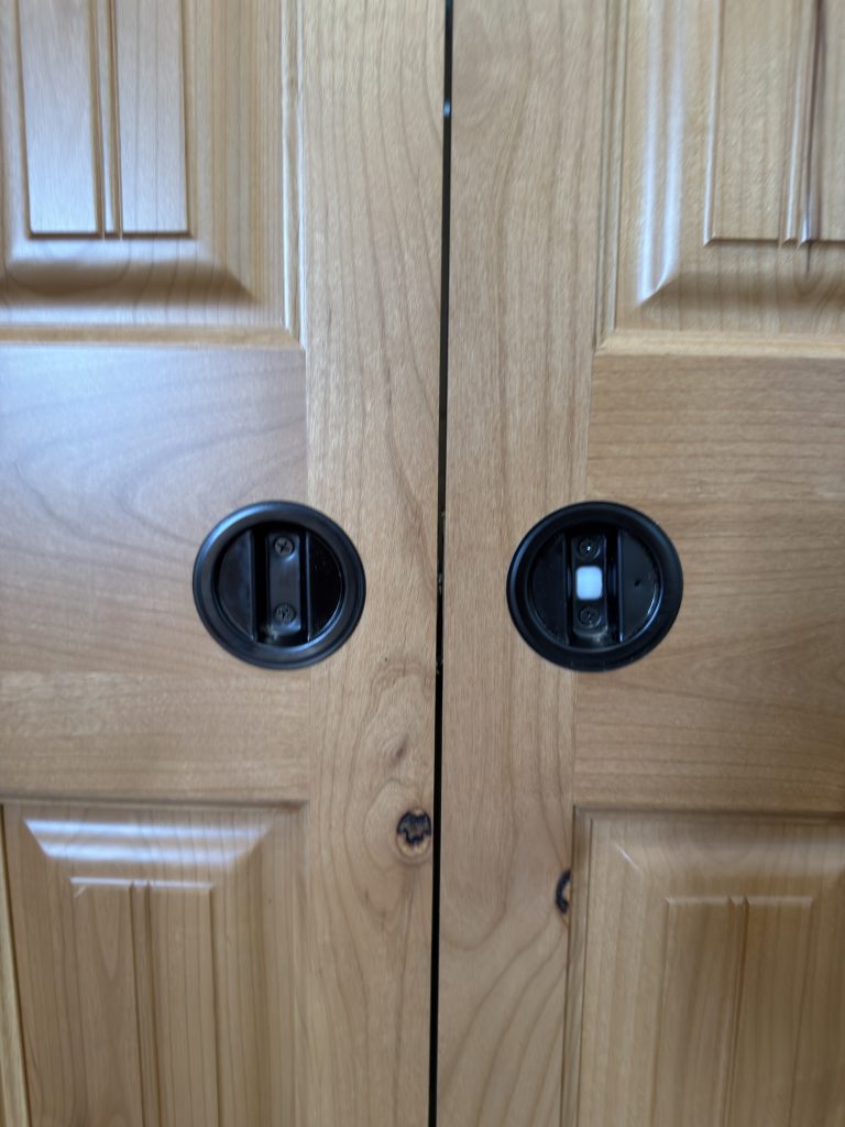 Detail view of Recessed Pocket Door Hardware in the Schrauth Camp.