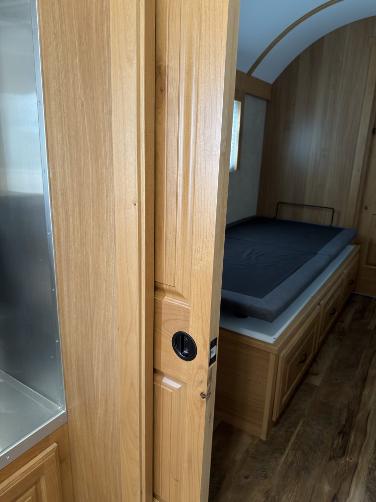 Detail view of Open Bedroom Pocket Door in the Schrauth Camp.