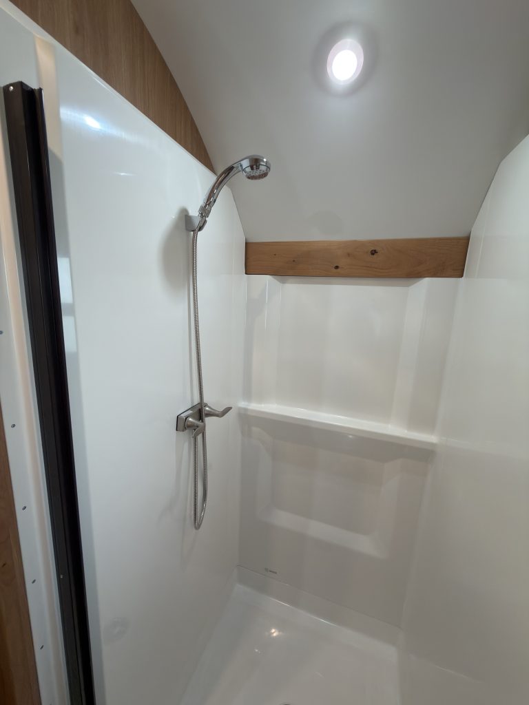 Large shower with stainless steel fixtures