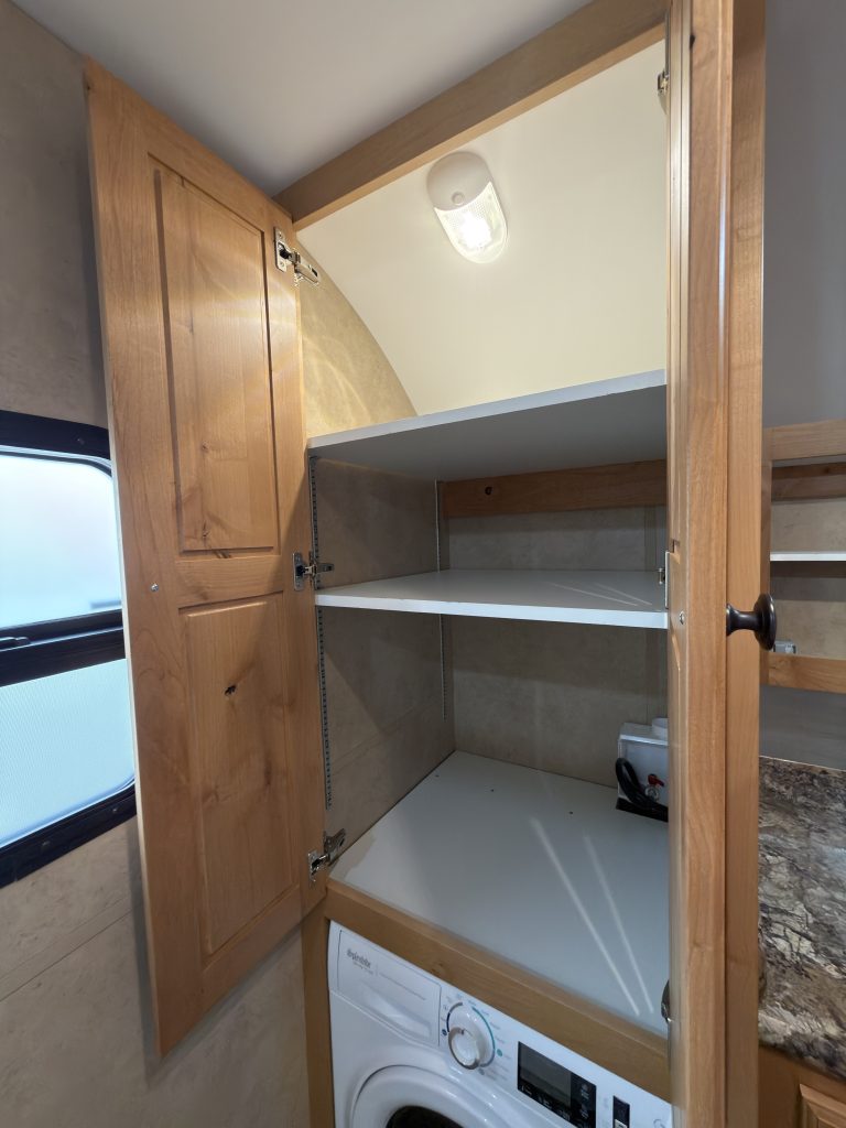 Detail view of Washer/Dryer Wardrobe Storage in the Schrauth Camp.