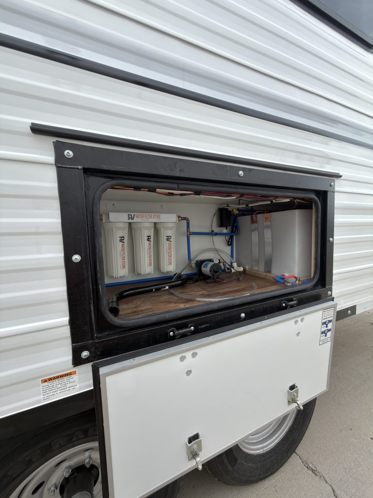 Open exterior water system compartment