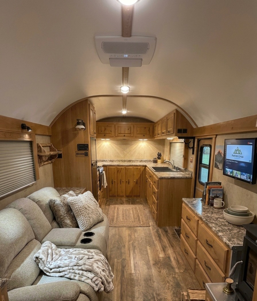 Interior of the Schrauth Camp featuring its living area and custom wood kitchen