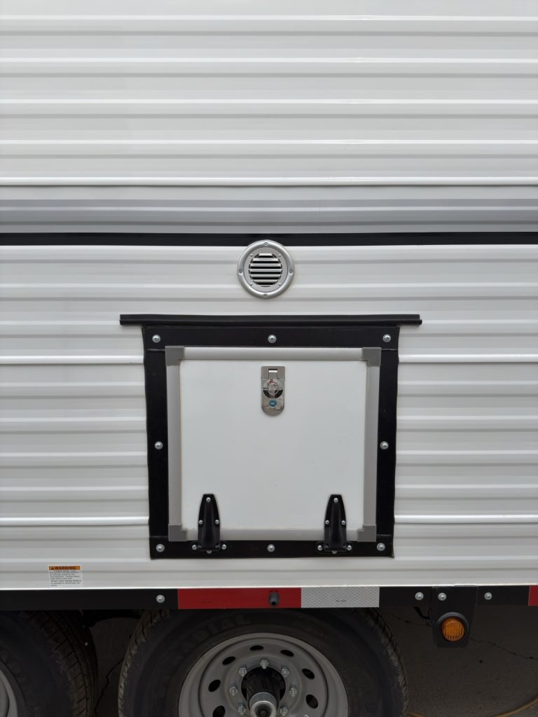 Fresh air intake above an exterior wood box.