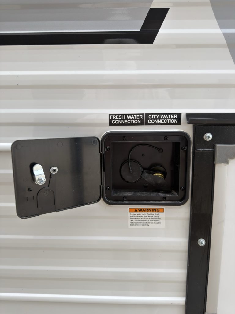 Fresh water and city water connections on the camp exterior.