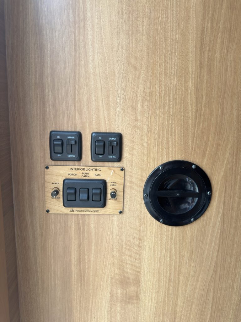 Wall panel with light switches and dimmers.