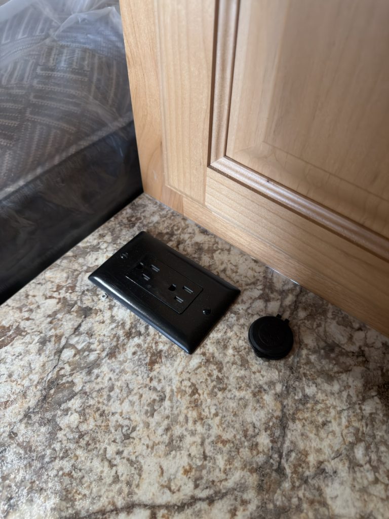 Black USB and power outlets set into the nightstand top.