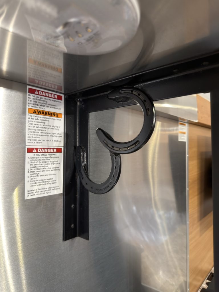 Horseshoe accent beneath the cabinetry.