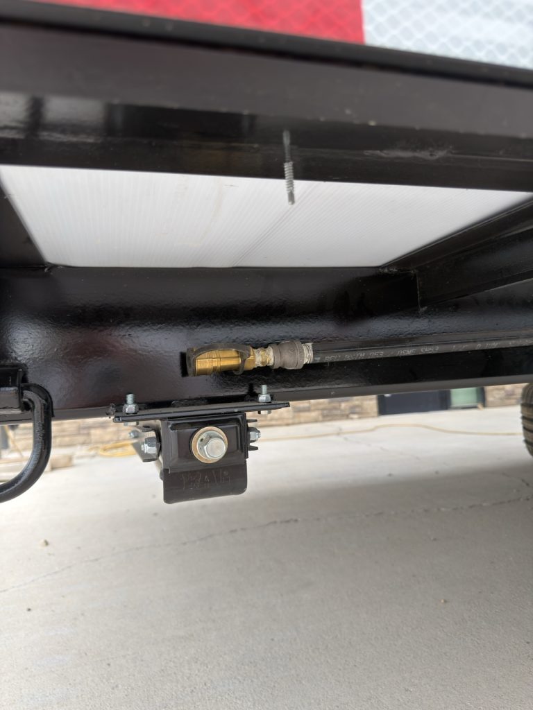 Rear propane connection mounted beneath the frame.