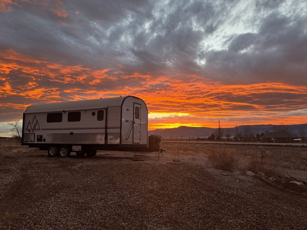 Peak Camp Beneath a Fiery Sunset