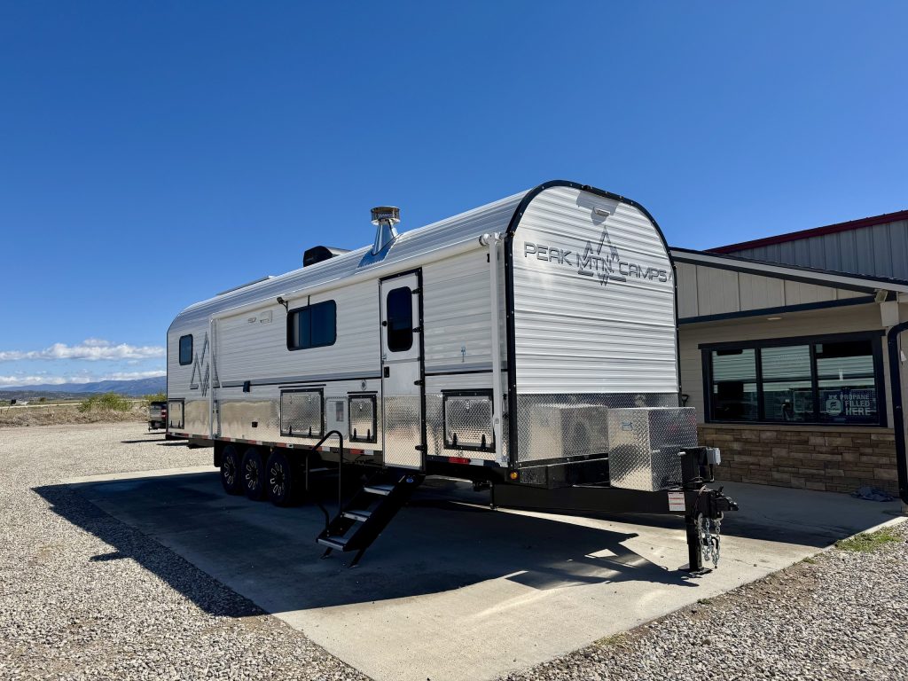 Peak Camp Exterior With Triple Axles