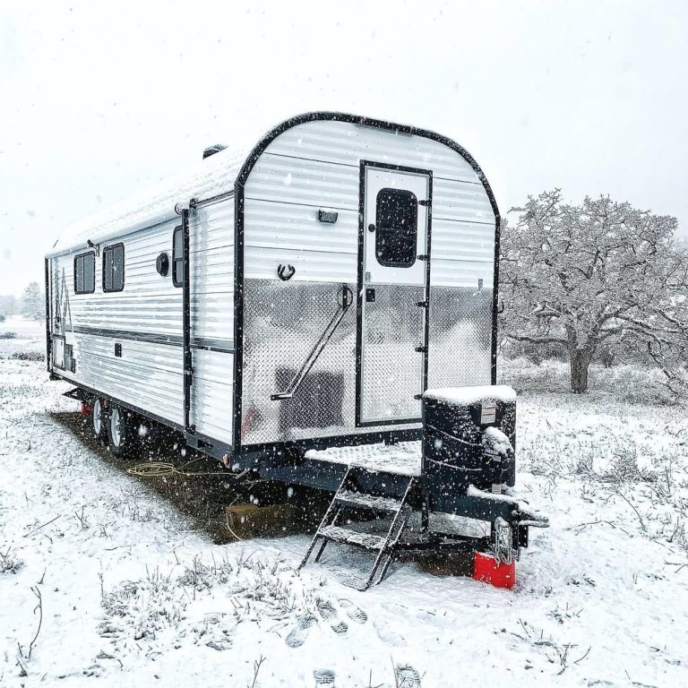 Peak camp set up during falling snow for winter camping