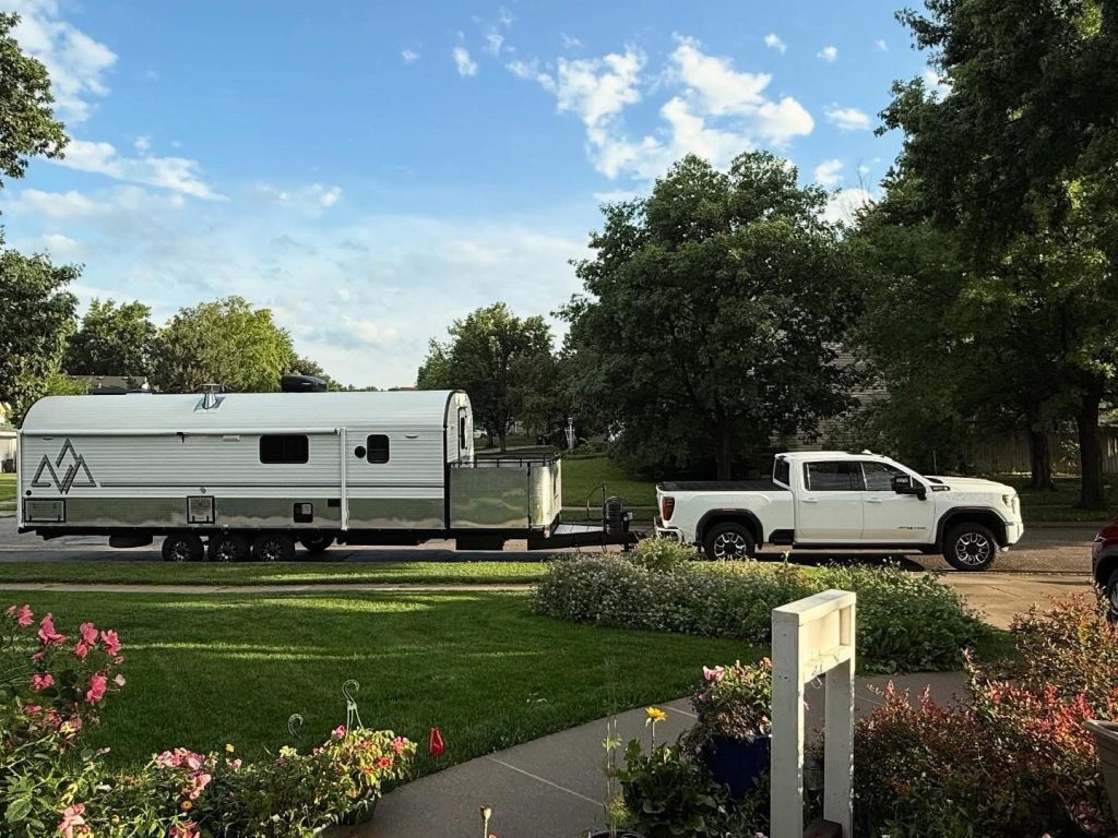 Peak Camp Parked Beside a Garden