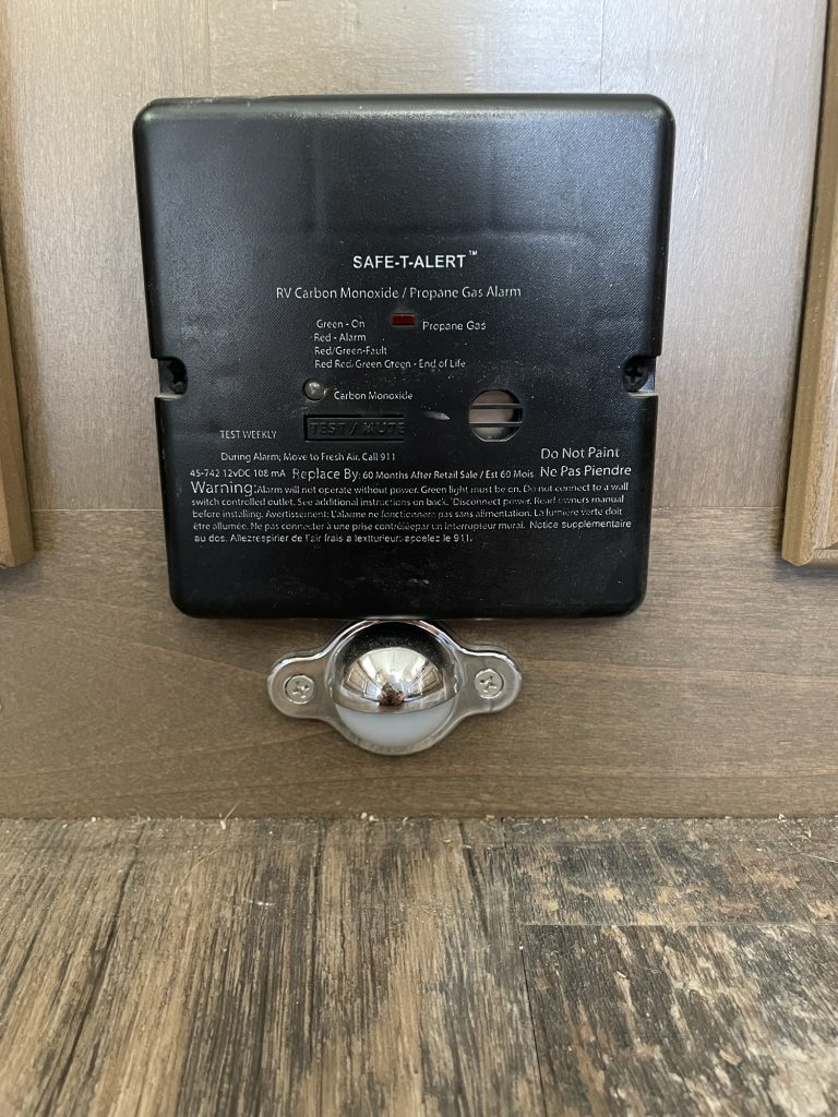 RV carbon monoxide and propane gas alarm installed inside a camp trailer