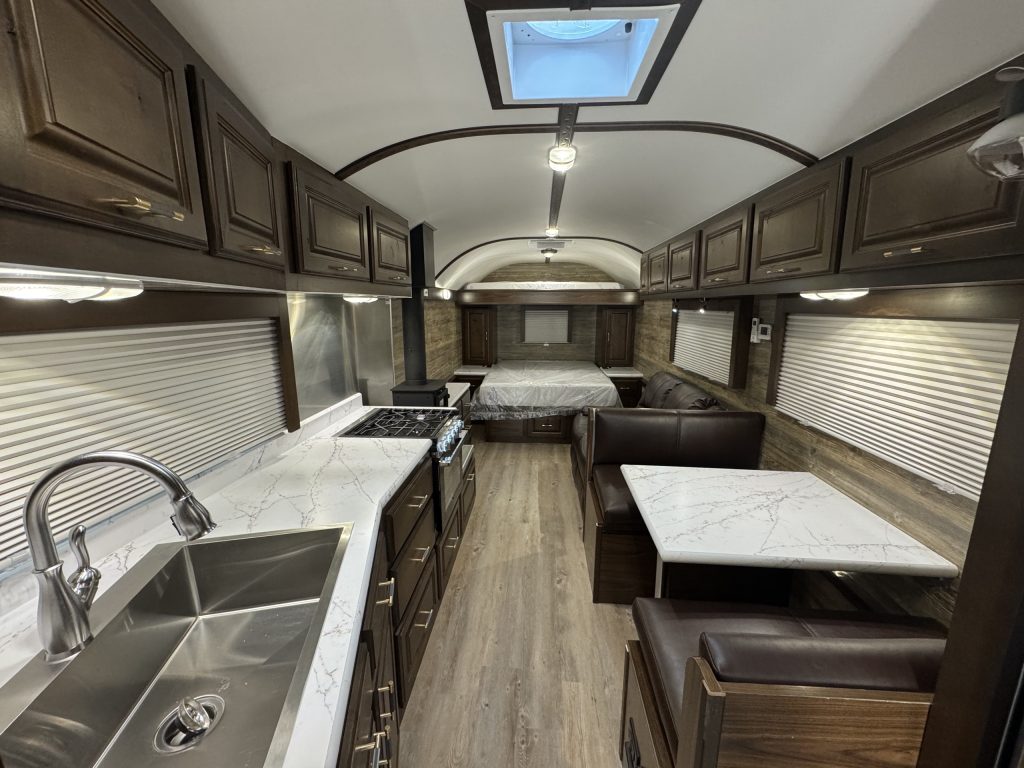 Kitchen and four-seat dinette inside the untitled X35 camp