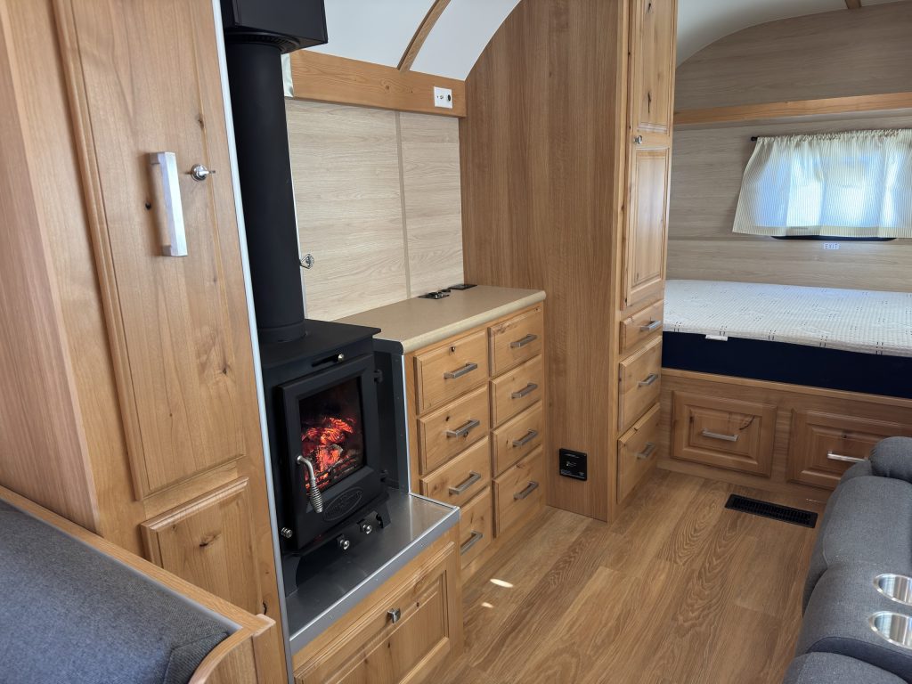 Wood Stove Beside Peak Camp Cabinetry