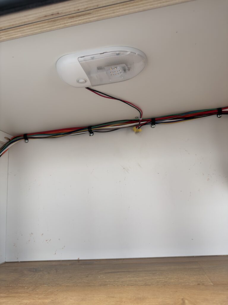 Image of the exterior storage compartment light of Gail Camp #131.