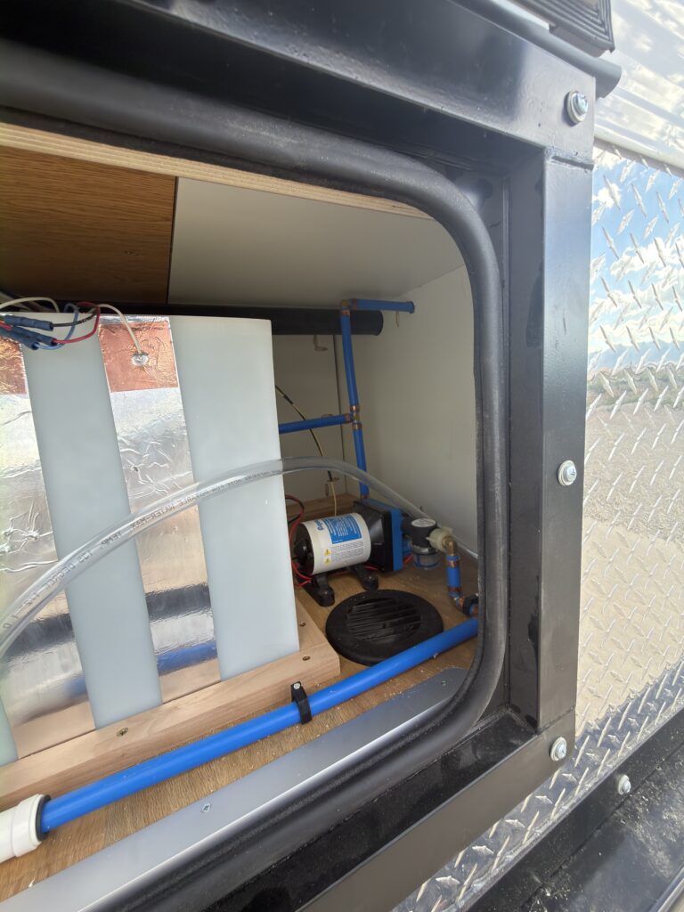 Image of the fresh water tank compartment with water pump of Gail Camp #131.