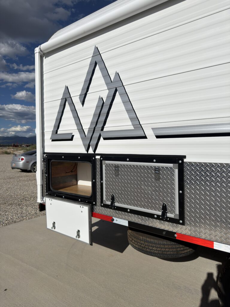 Image of the passenger-side storage compartments of Gail Camp #131.