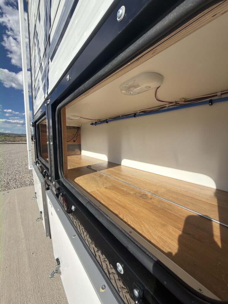 Image of the long exterior storage compartment of Gail Camp #131.
