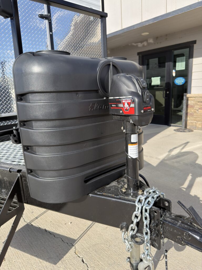 Image of the front propane tanks and hitch of Gail Camp #131.