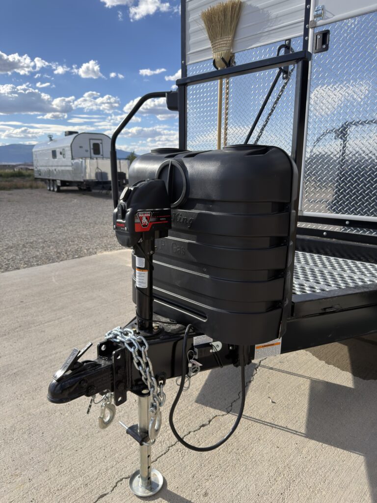 Image of the propane tanks and hitch assembly of Gail Camp #131.