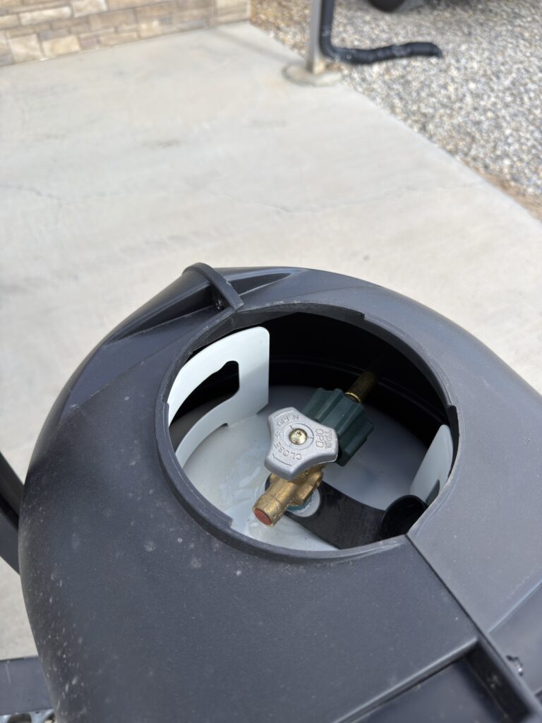 Image of the propane cylinder cover access port of Gail Camp #131.