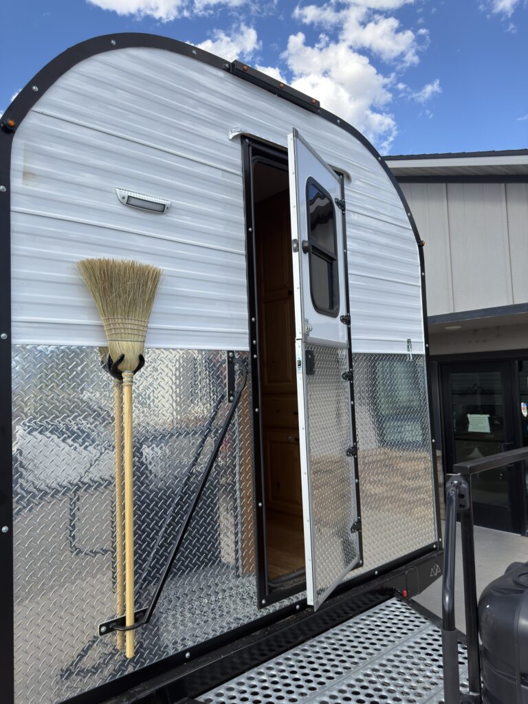 Image of the entry door and broom mount of Gail Camp #131.