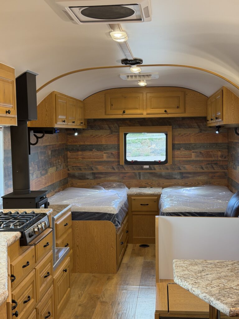 View of the kitchen-to-bedroom interior of Gail Camp #131.