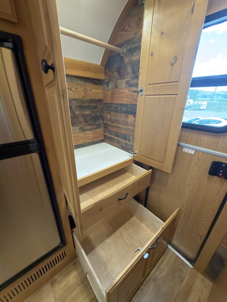 Image of the open closet drawers of Gail Camp #131.
