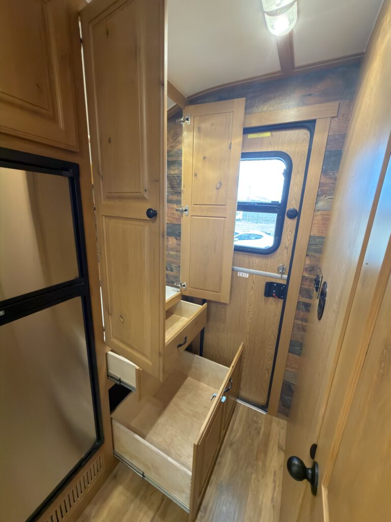 Image of the entry storage cabinet and drawers of Gail Camp #131.