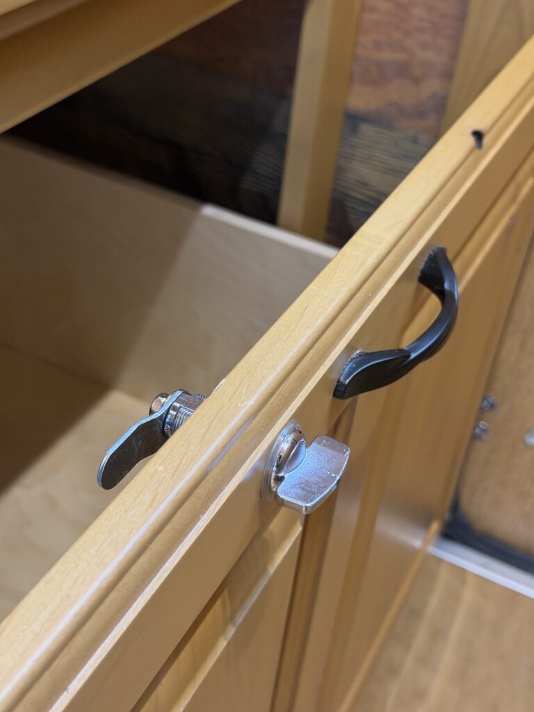 Image of the cabinet drawer and latch of Gail Camp #131.