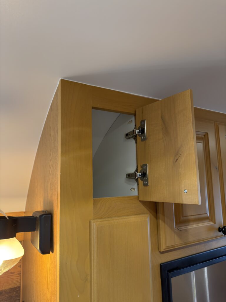 Image of the small upper pantry cabinet of Gail Camp #131.