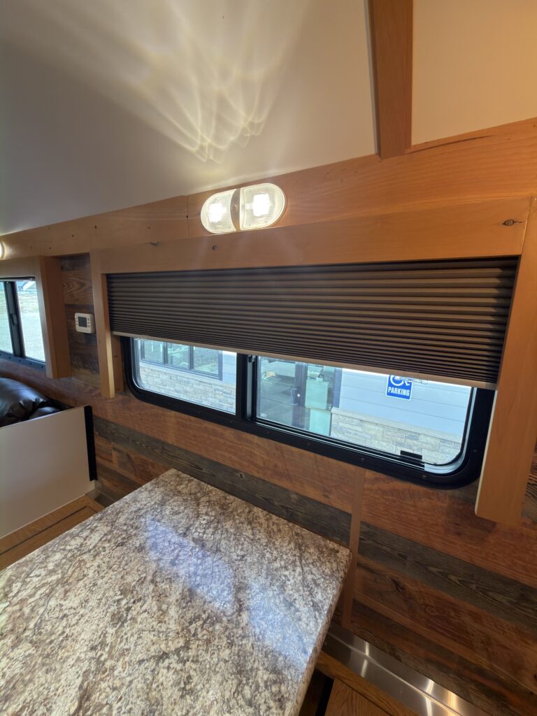 Image of the dinette and window shade of Gail Camp #131.