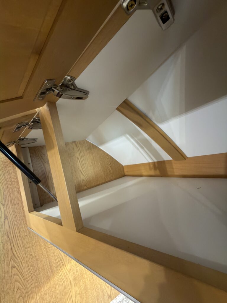 Image of the open overhead cabinet compartment of Gail Camp #131.