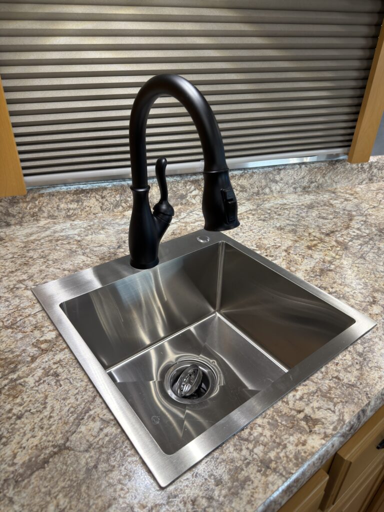 Image of the kitchen sink and faucet of Gail Camp #131.