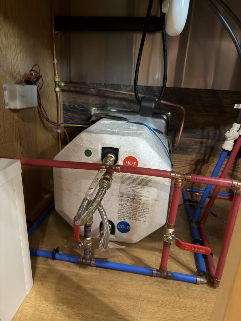 Image of the water-heater plumbing close-up of Gail Camp #131.