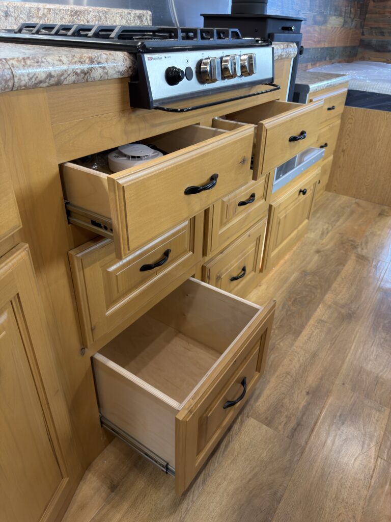 Image of the kitchen drawers opened of Gail Camp #131.