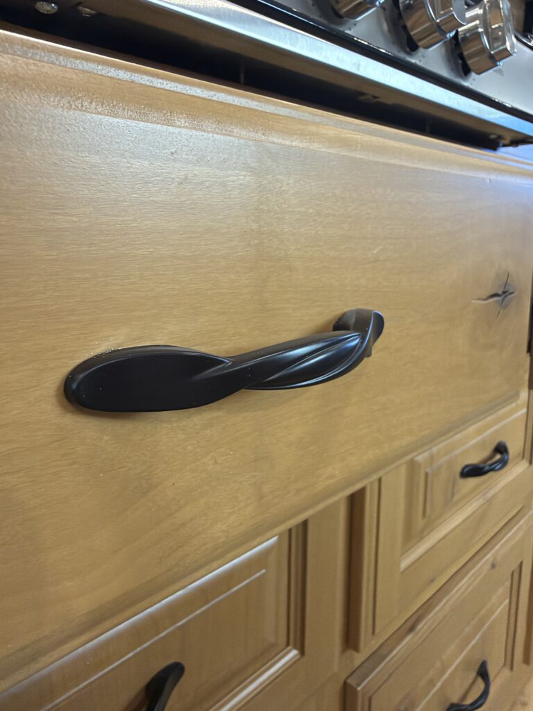 Image of the kitchen cabinet handle detail of Gail Camp #131.