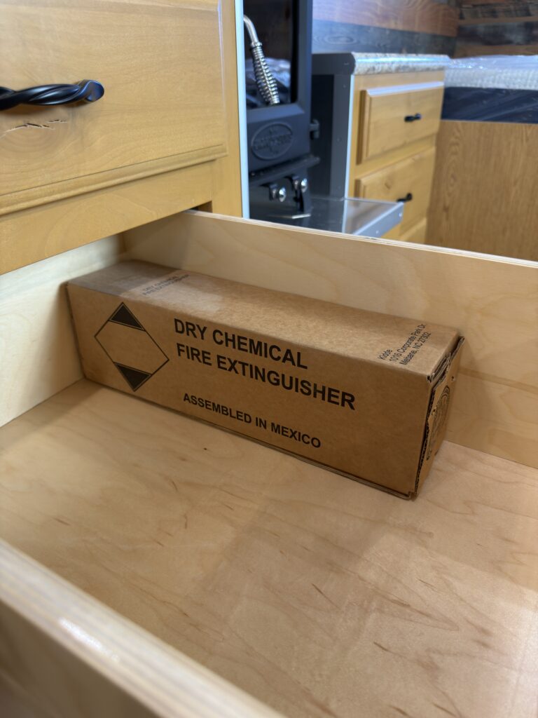 Image of the fire extinguisher stored in drawer of Gail Camp #131.
