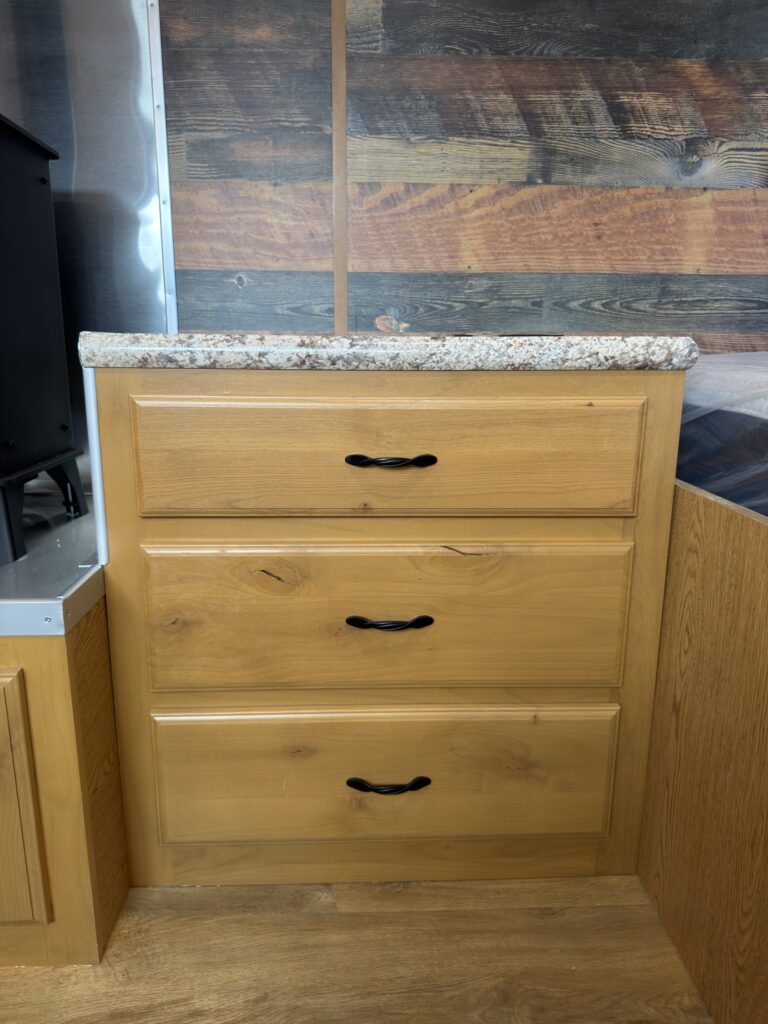 Image of the entertainment center drawers of Gail Camp #131.