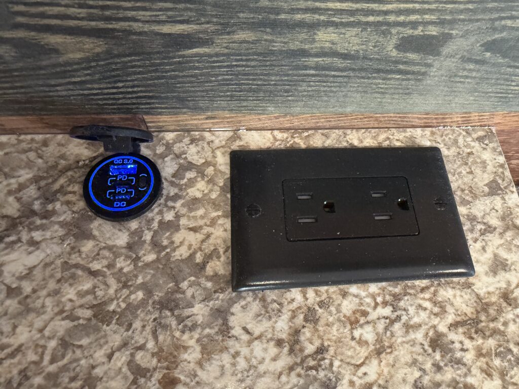 Image of the uSB charging port and electrical outlet of Gail Camp #131.