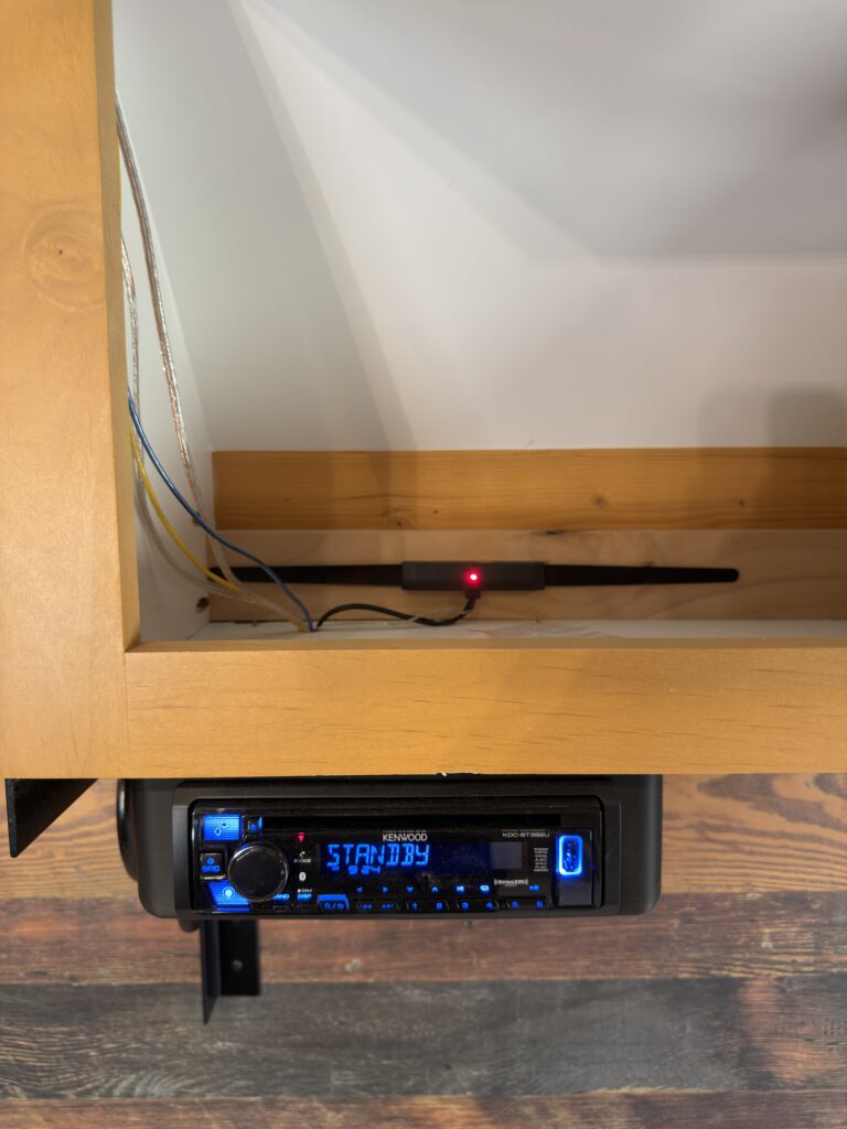 Image of the stereo and overhead shelf of Gail Camp #131.