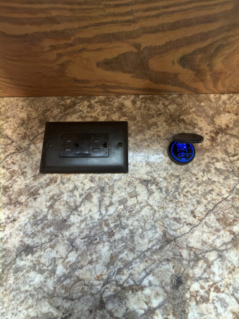 Image of the bedroom outlet and USB charging port of Gail Camp #131.