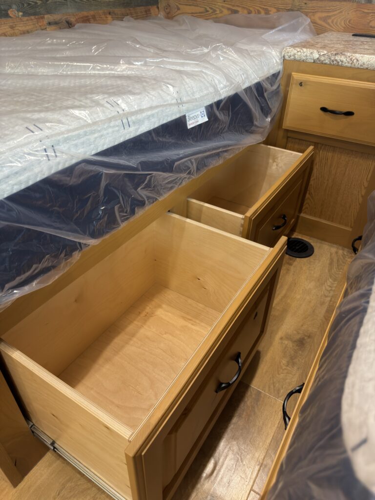 Image of the under-bed storage drawers of Gail Camp #131.