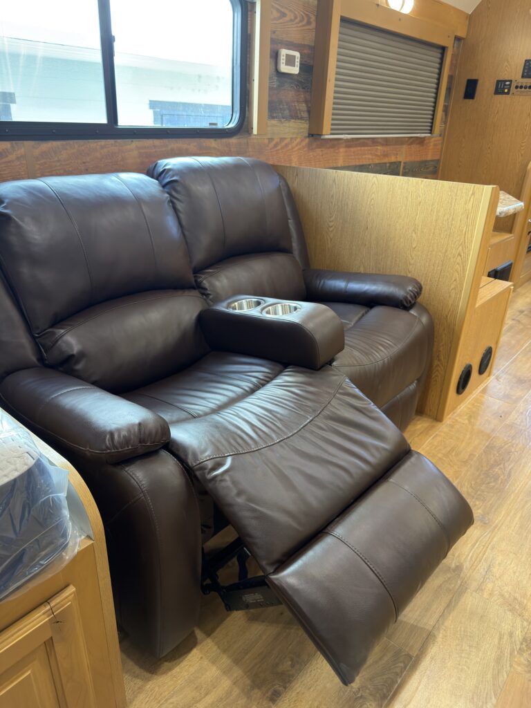 Image of the reclining sofa with footrest extended of Gail Camp #131.