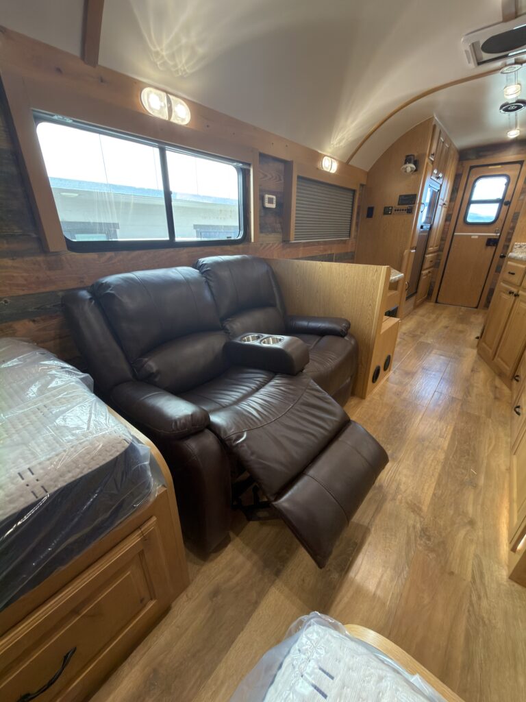 Image of the reclining sofa and main aisle of Gail Camp #131.